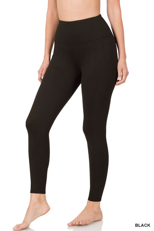 Model wearing black leggings in front of white background