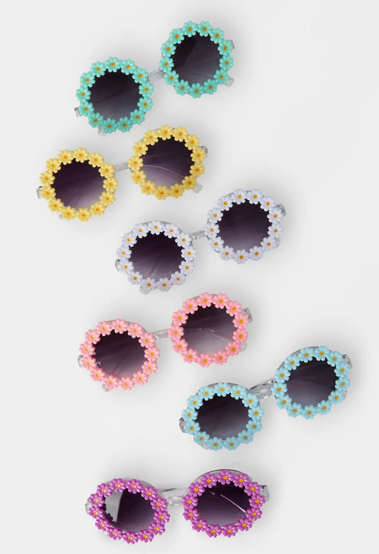 Set of colorful floral sunglasses on a white background