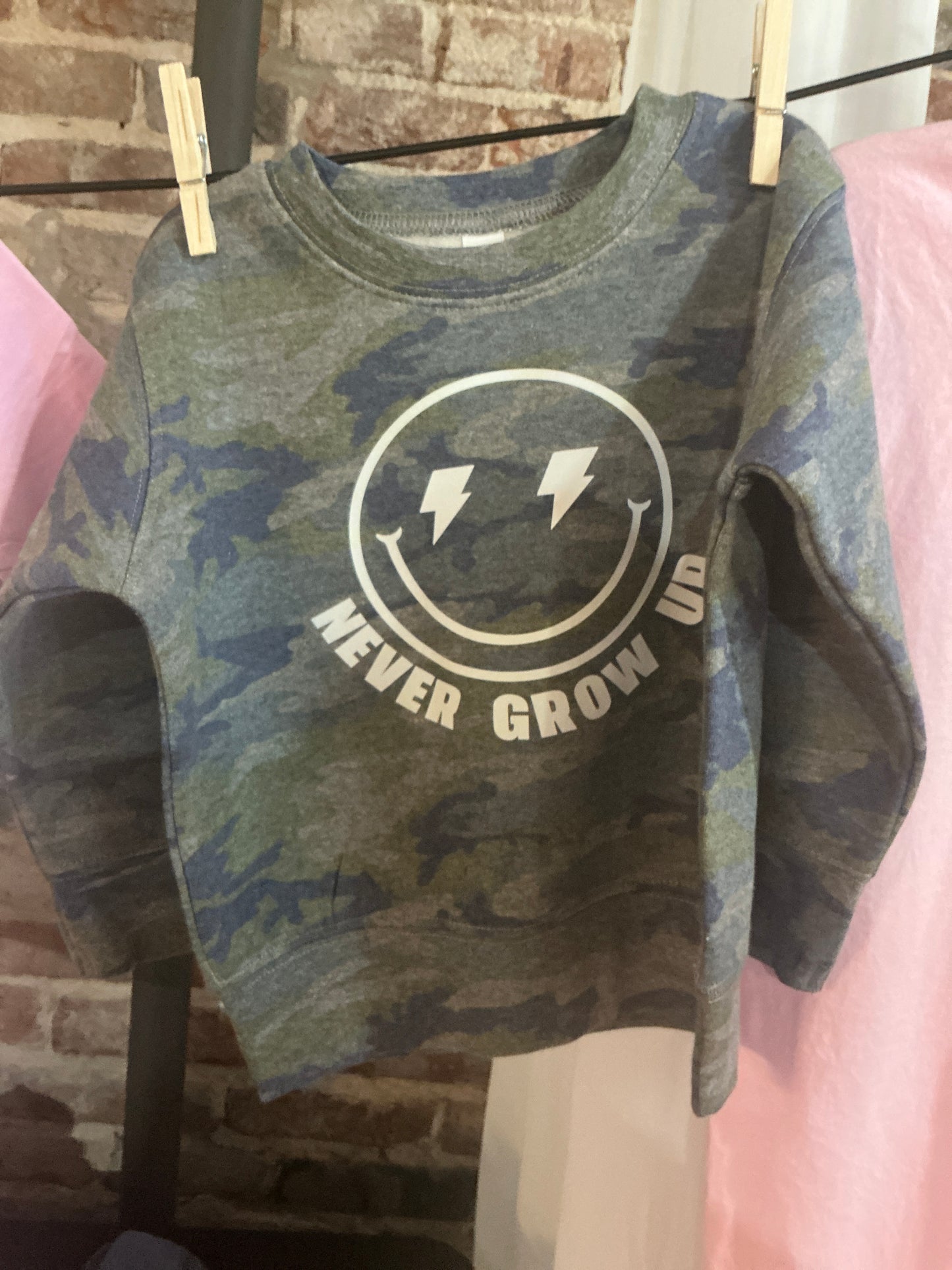 Never Grow Up Sweatshirt