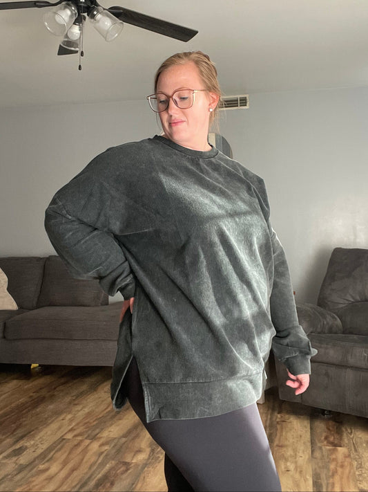 woman wearing a vintage black corded pullover and black leggings