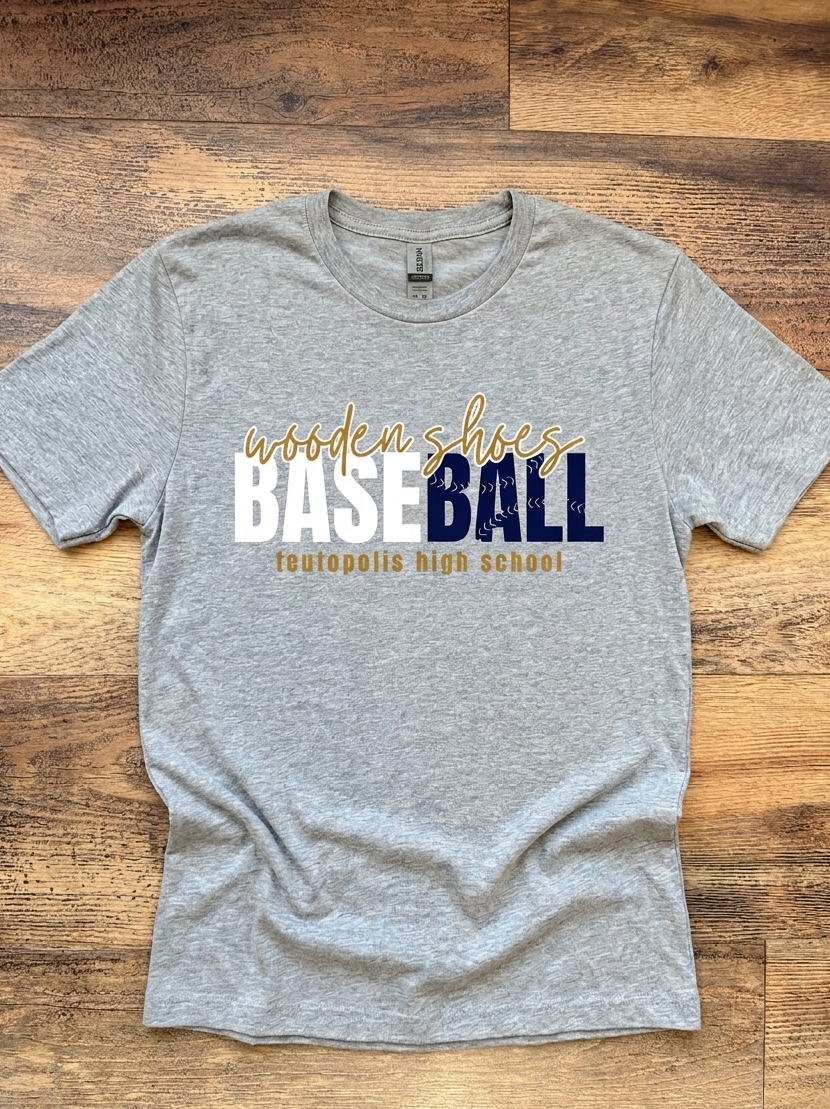 Flat lay of grey shirt with baseball design that says wooden shoes baseball teutopolis high school