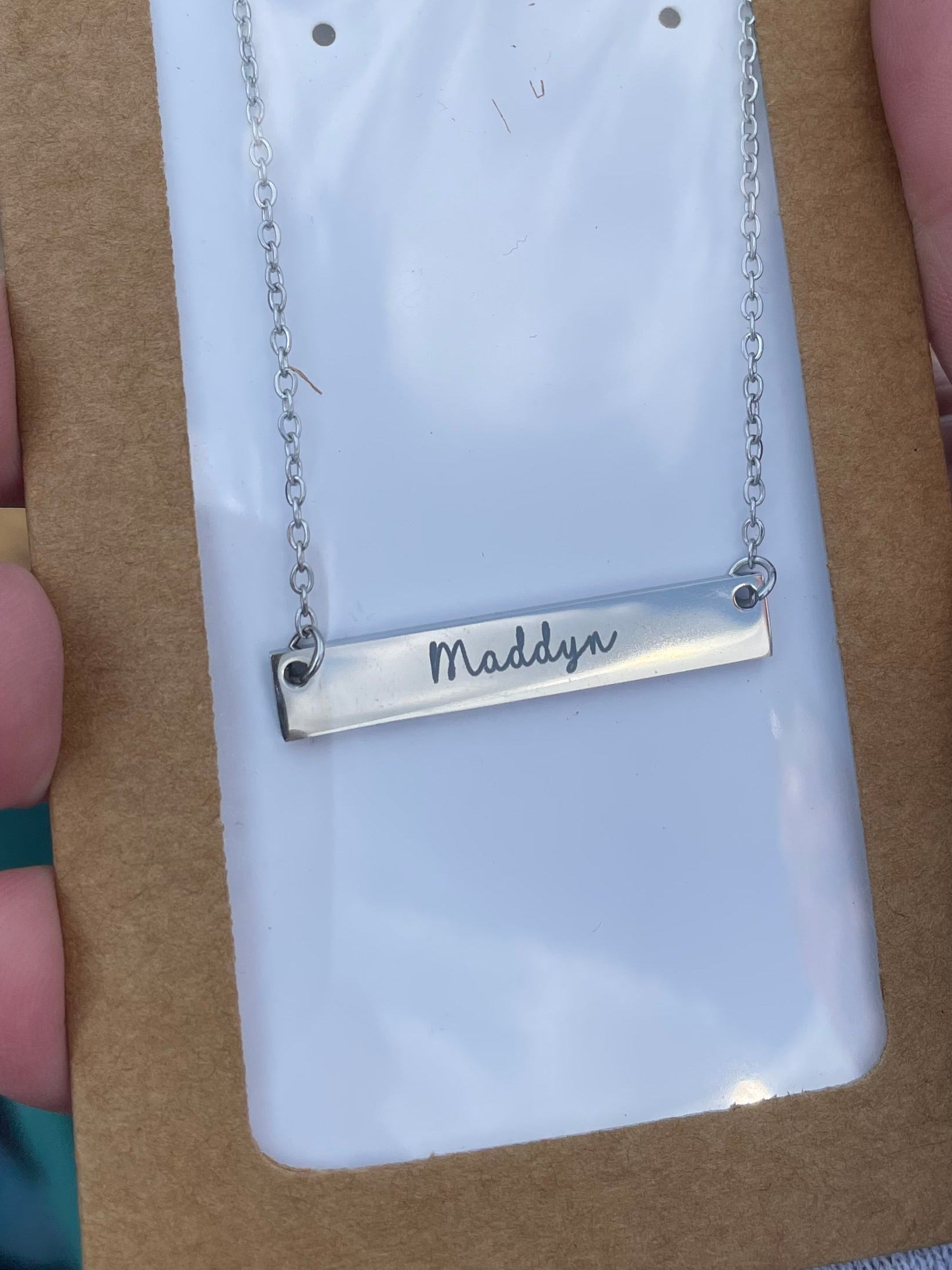 Custom engraved bar necklace with "Maddyn" in script font"