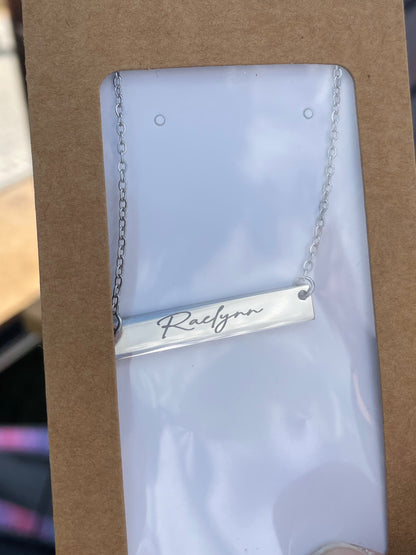 Custom engraved bar necklace with "Raelynn"
