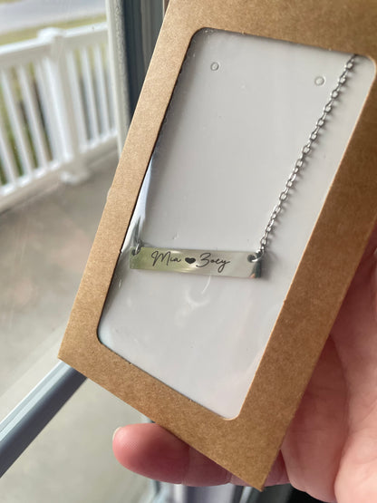 Custom engraved bar necklace with "Mia & Zoey" script design