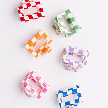 Set of colorful checkered square clips on a white background