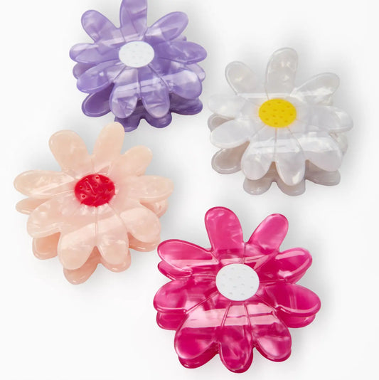 Set of colorful flower-shaped hair clips on a white background