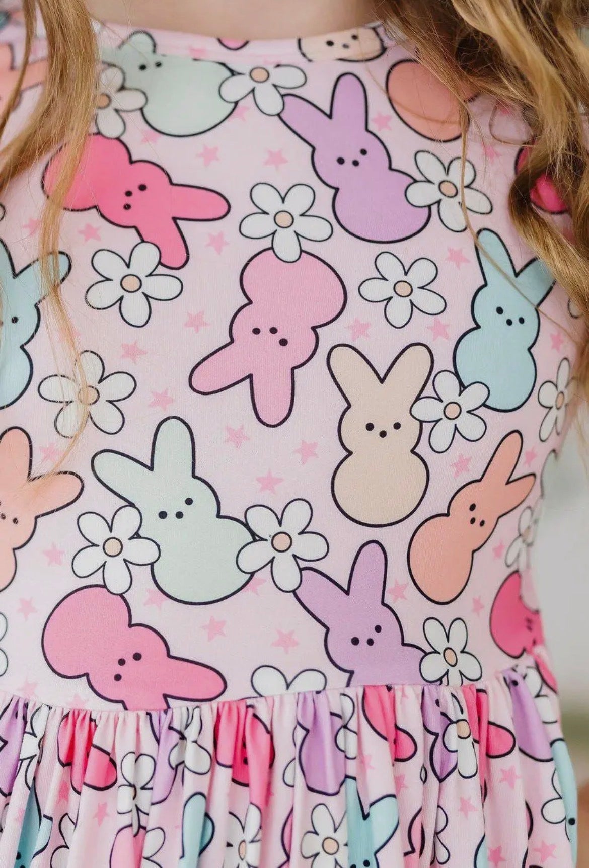 Dress with colorful bunny and flower pattern on a white background