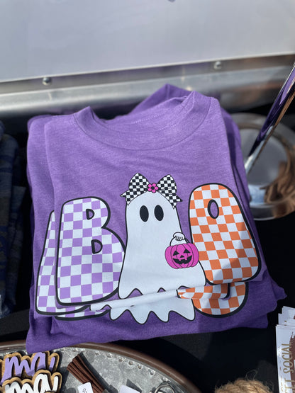 Purple shirt with Halloween-themed design featuring a ghost, checkered letters, and candy corn.