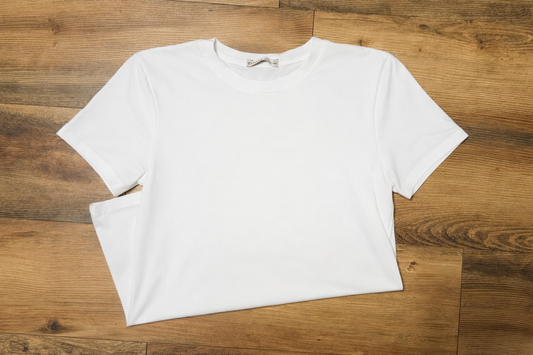 White t-shirt on a wooden surface